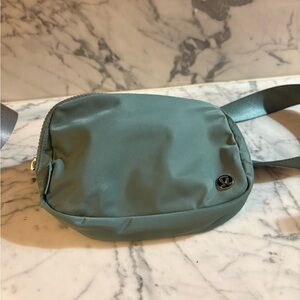 lululemon athletica Teal Crossbody Bag-this one has some wear to it.